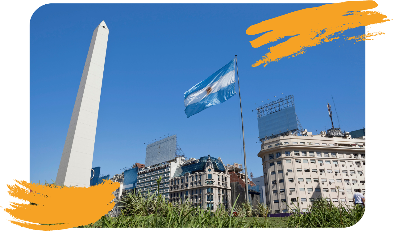 Foto da capital da Argentina, com um monumento e uma bandeira do país